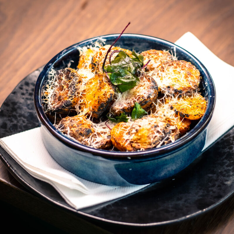 calabrian chilli potatoes pecorino dish at W Cafe & Bar
